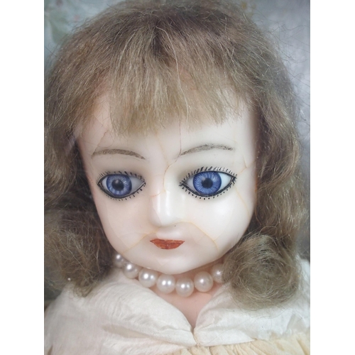 316 - An early wax over doll