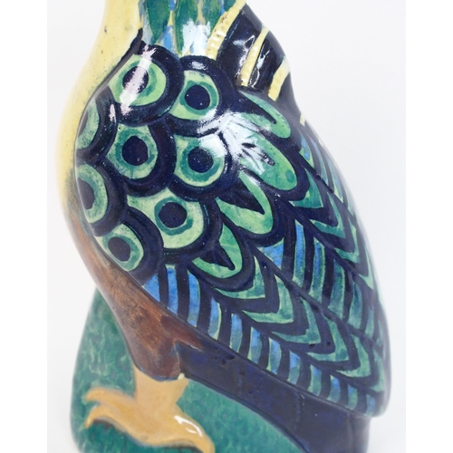 523 - Elizabeth Mary Watt (1886-1954) A pottery figure of a parrot