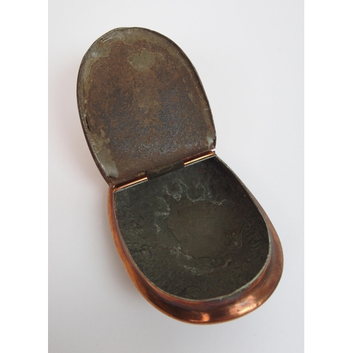 543 - A copper snuff box with chased foliate decoration