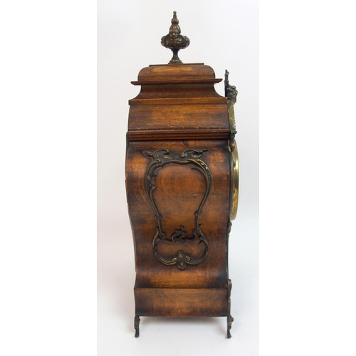 552 - A late 19th century / early 20th century walnut mantle clock