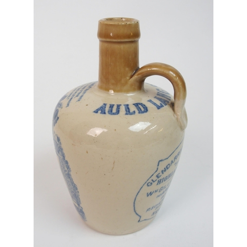 558 - A Cochran and Fleming Britannia Pottery whisky jug