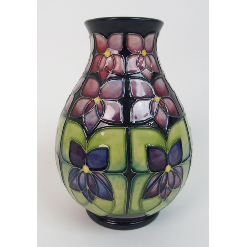 564 - A Moorcroft Violet pattern vase