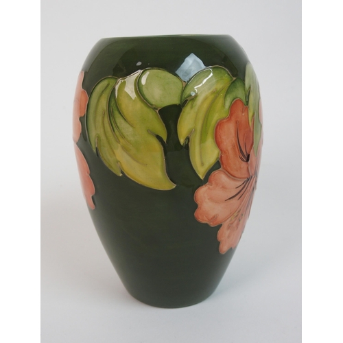 564 - A Moorcroft Violet pattern vase