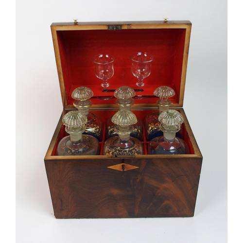 567 - A 19th century flame mahogany decanter box