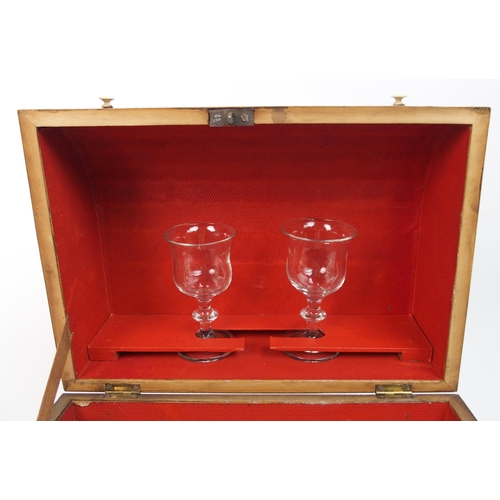 567 - A 19th century flame mahogany decanter box