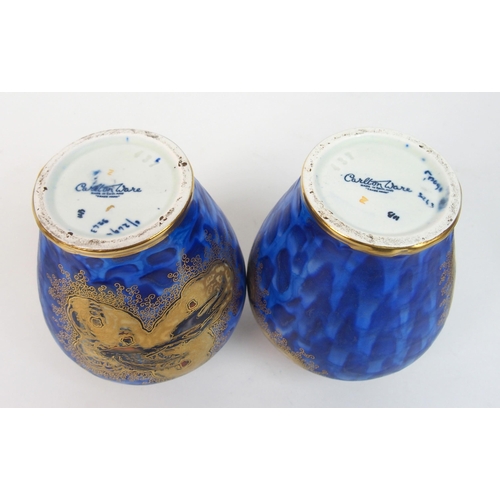 571 - A pair of Carlton Ware Paradise Bird and Tree pattern jars and covers