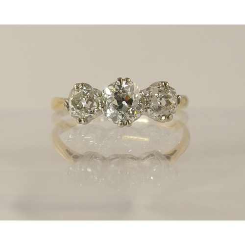 614 - An 18ct three stone old cut diamond ring