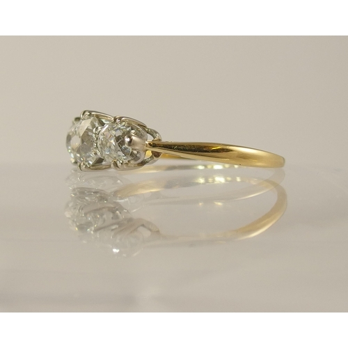 614 - An 18ct three stone old cut diamond ring