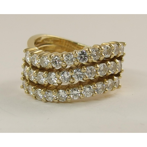 615 - A triple row diamond wave ring