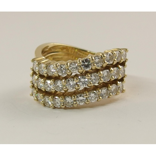 615 - A triple row diamond wave ring