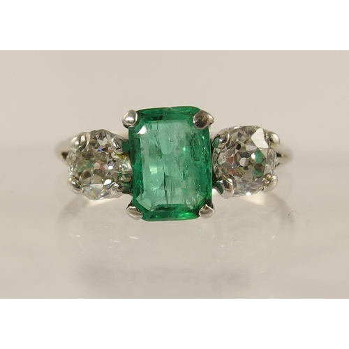 617 - A platinum emerald and diamond ring