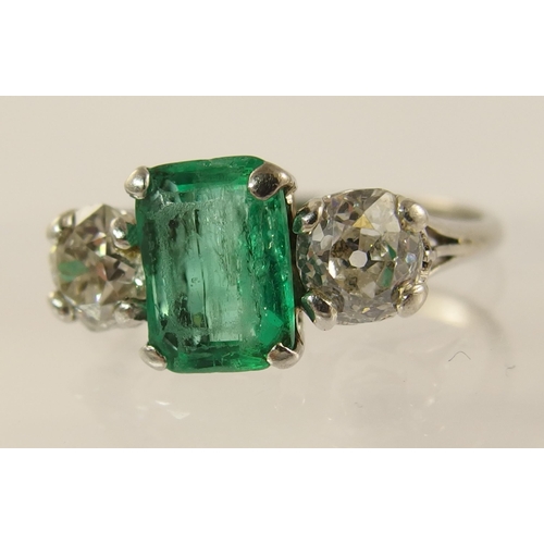 617 - A platinum emerald and diamond ring