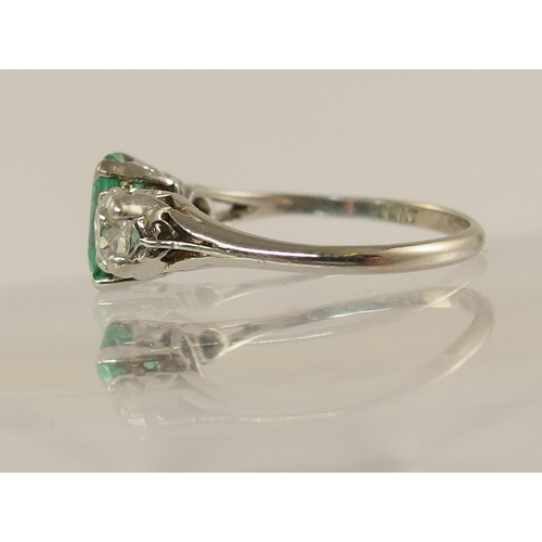 617 - A platinum emerald and diamond ring