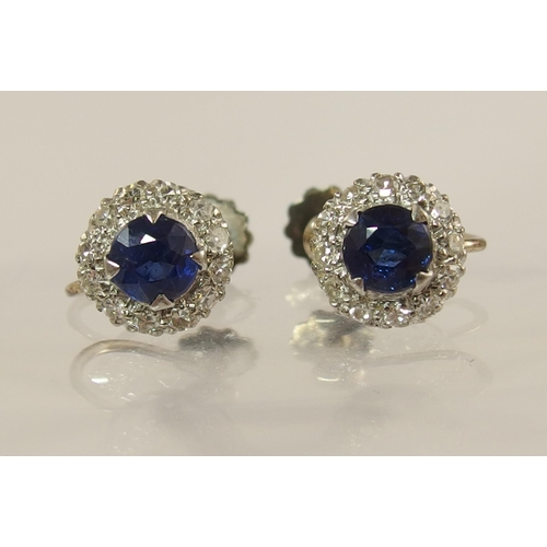 618 - A pair of 9ct yellow and white gold sapphire and diamond earrings