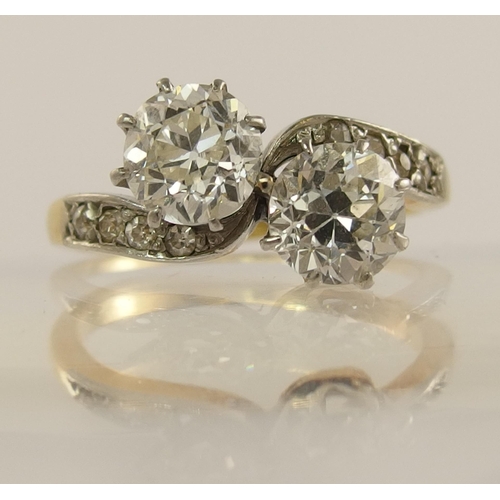 623 - A classic old cut twin diamond ring on a twist