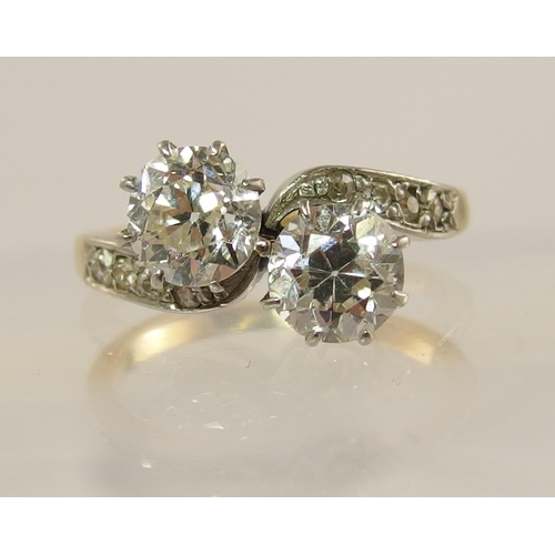 623 - A classic old cut twin diamond ring on a twist