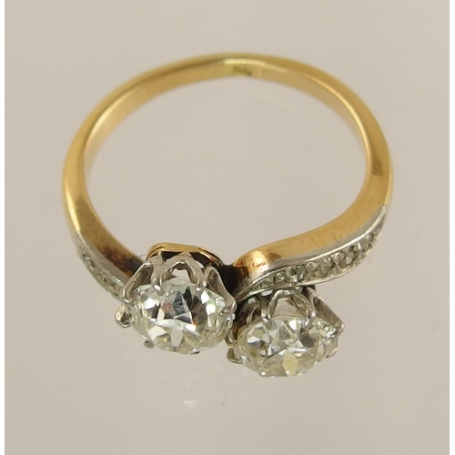 623 - A classic old cut twin diamond ring on a twist