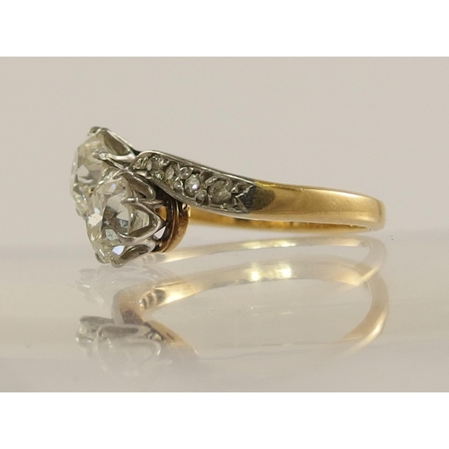 623 - A classic old cut twin diamond ring on a twist