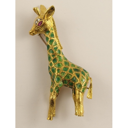 628 - A yellow metal giraffe brooch set with diamonds and ruby