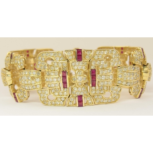 633 - A 14ct ruby and diamond bracelet of Art Deco style