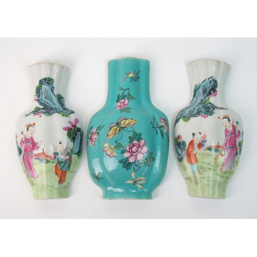 64 - A pair of Canton famille rose vase shaped wall plaques