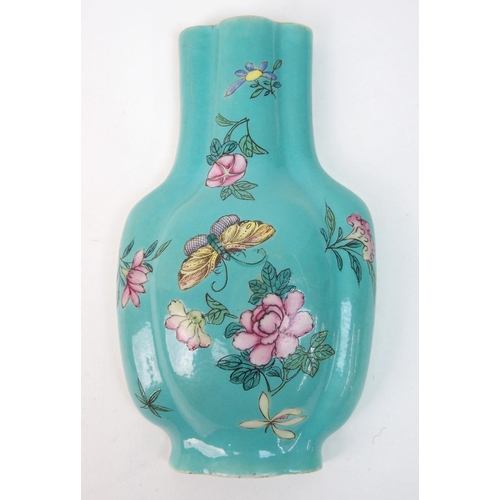 64 - A pair of Canton famille rose vase shaped wall plaques