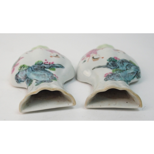 64 - A pair of Canton famille rose vase shaped wall plaques