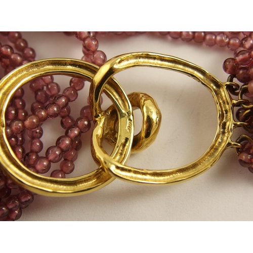 642 - A garnet and pearl festoon necklace with a 14ct gold clasp