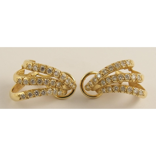 643 - A pair of 14ct gold diamond spray earrings