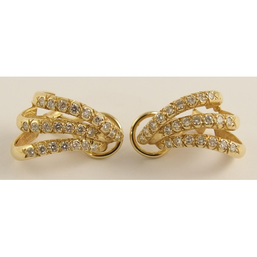 643 - A pair of 14ct gold diamond spray earrings