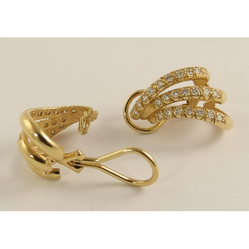 643 - A pair of 14ct gold diamond spray earrings