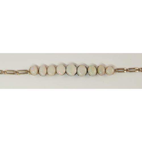 647 - A graduated white opal bracelet