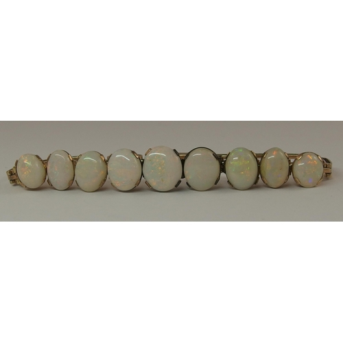 647 - A graduated white opal bracelet