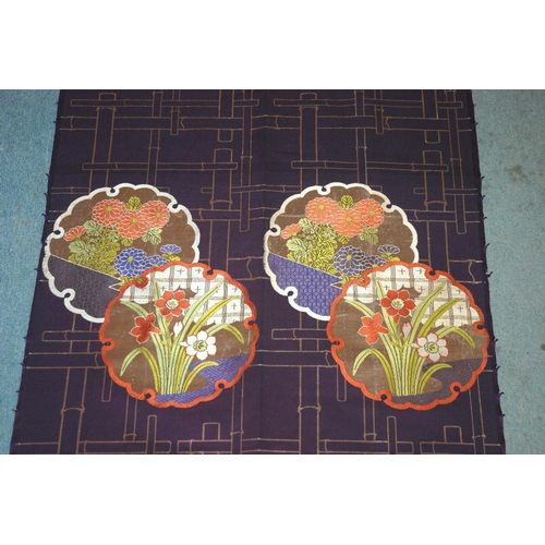 65 - A pair of Chinese silk embroidered panels