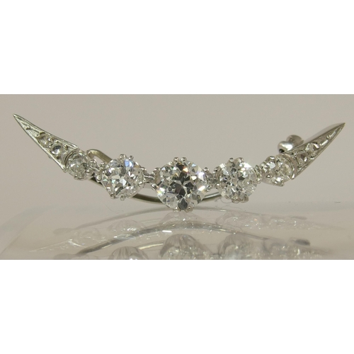 656 - A diamond crescent moon brooch of approx 1.75cts