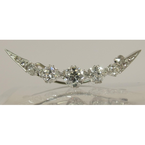 656 - A diamond crescent moon brooch of approx 1.75cts