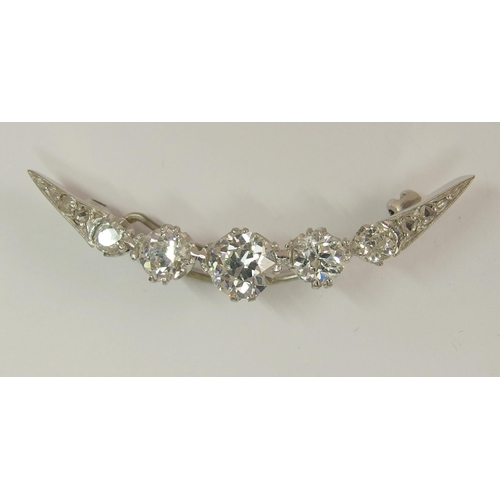 656 - A diamond crescent moon brooch of approx 1.75cts