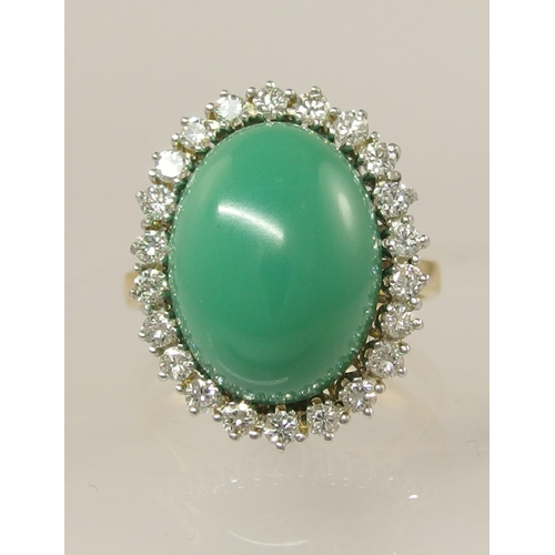 658 - An 18ct gold turquoise and diamond cluster ring