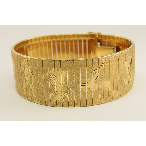 666 - An 18ct yellow gold wide cuff bracelet