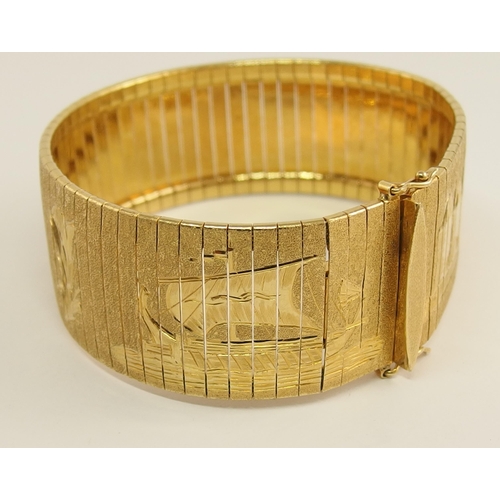 666 - An 18ct yellow gold wide cuff bracelet