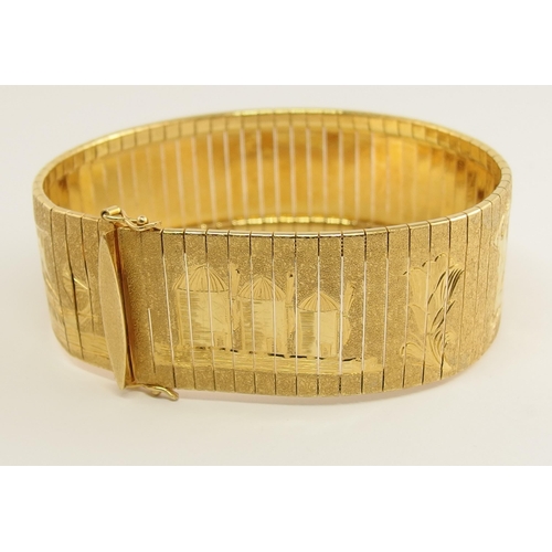 666 - An 18ct yellow gold wide cuff bracelet