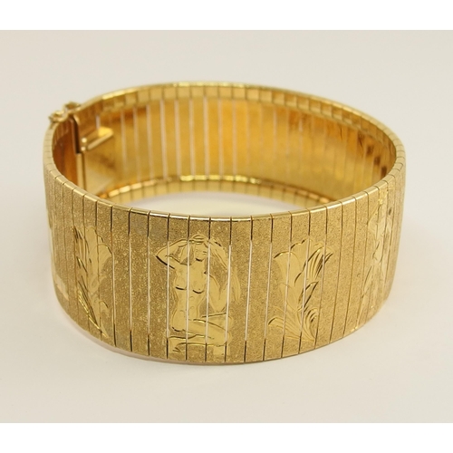 666 - An 18ct yellow gold wide cuff bracelet