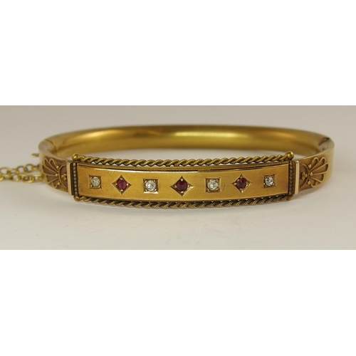 680 - A 15ct gold Victorian ruby and diamond bangle