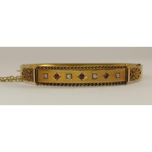 680 - A 15ct gold Victorian ruby and diamond bangle