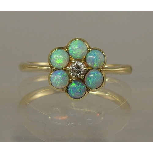 682 - An opal and diamond flower ring