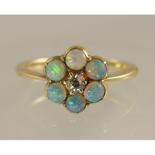 682 - An opal and diamond flower ring