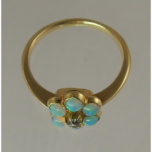 682 - An opal and diamond flower ring