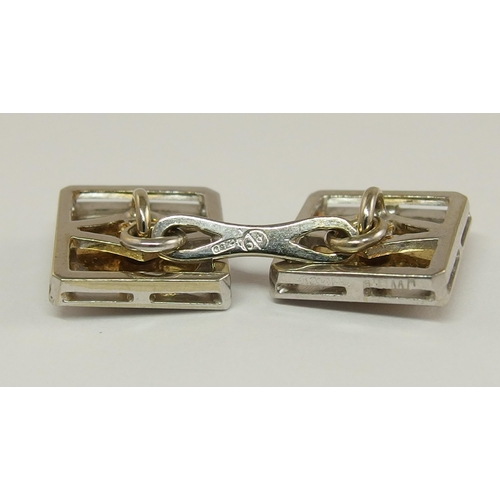 687 - A pair of 18ct yellow and white gold diamond set cufflinks