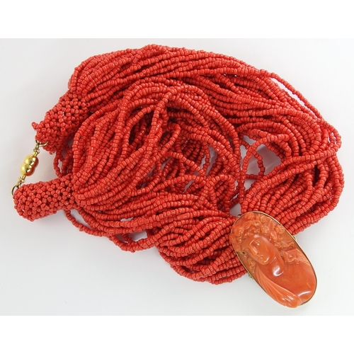 689 - A carved coral cameo necklace