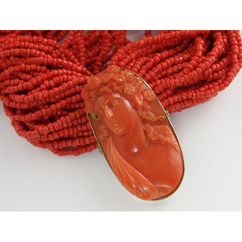 689 - A carved coral cameo necklace